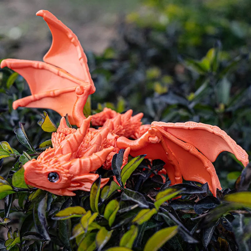 Red and gold printed dragon wings decorative toy made of PLA plastic.
