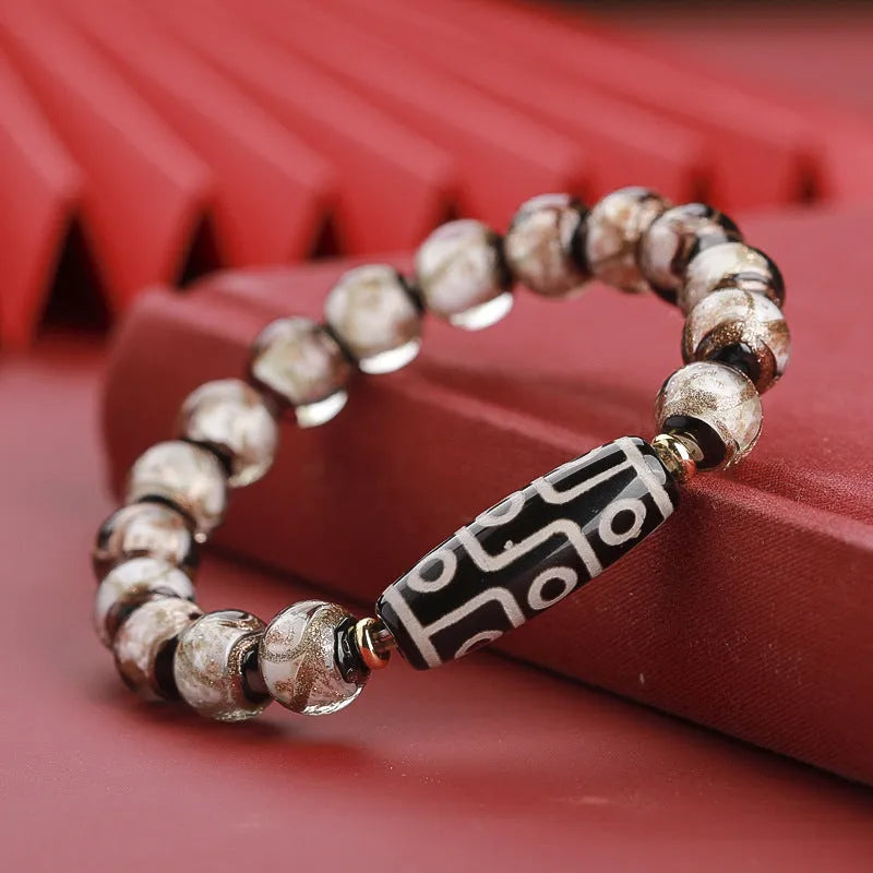 Close-up of a colourful Chinese snake year lucky bead bracelet made from hand-strung coloured glaze.