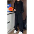Men's black long sleeve polo shirt and trousers two-piece casual suit set on hanger