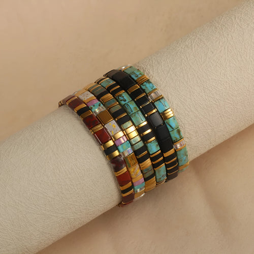 Geometric glass pull bead bracelet in milky white, black, green, blue or red with round decorative elements