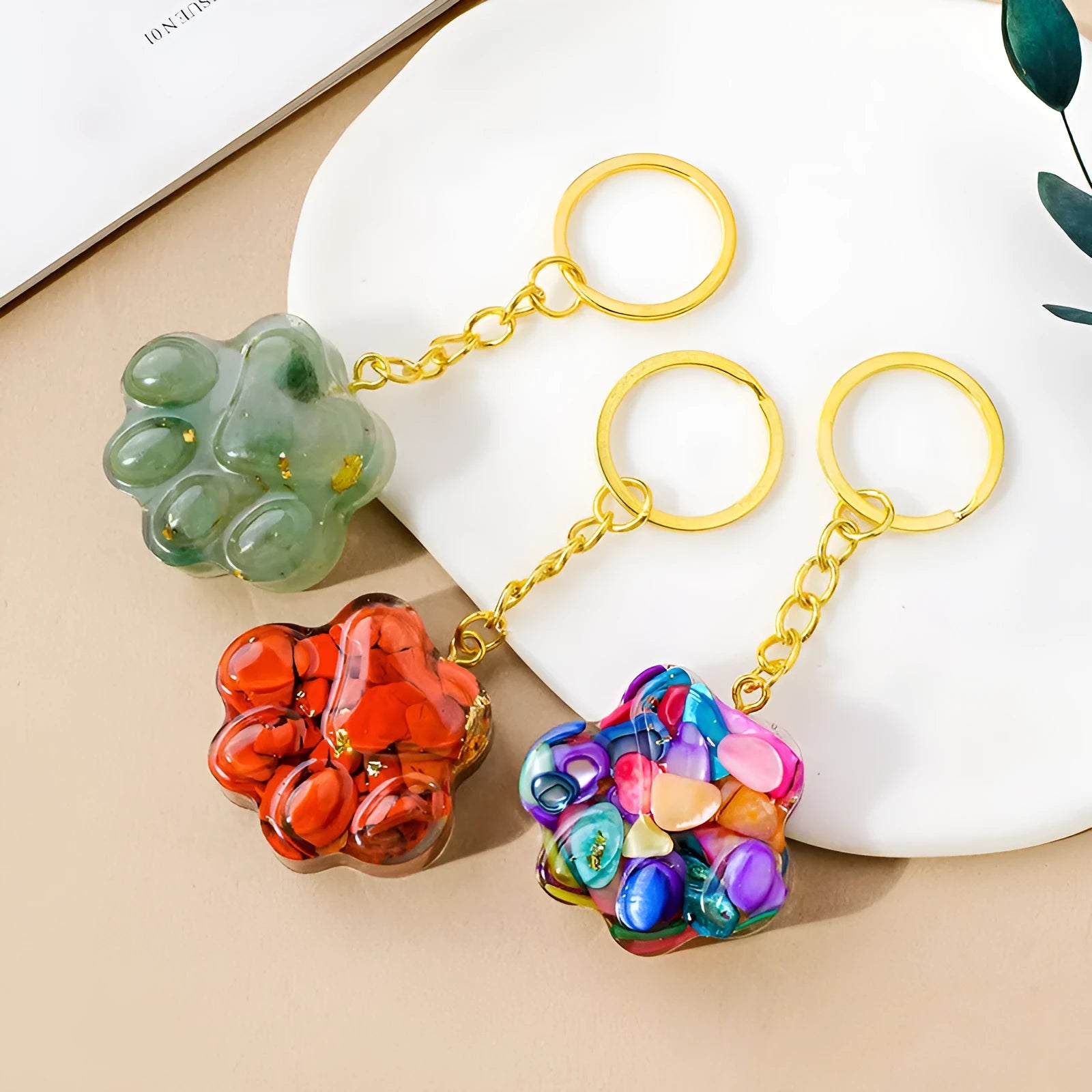 Natural crystal cat's paw keychain pendant on a metal ring in one of ten random stone colours.