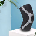 Red and grey silicone sports kneecaps for running and climbing with non-slip design