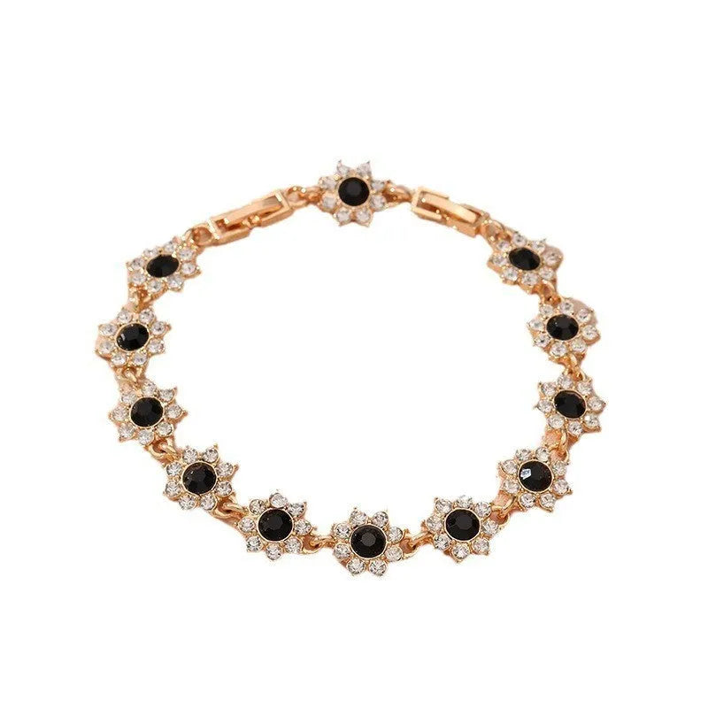 Floral coloured gemstone bracelet in zinc alloy with electroplated gold and silver crystal finishes.