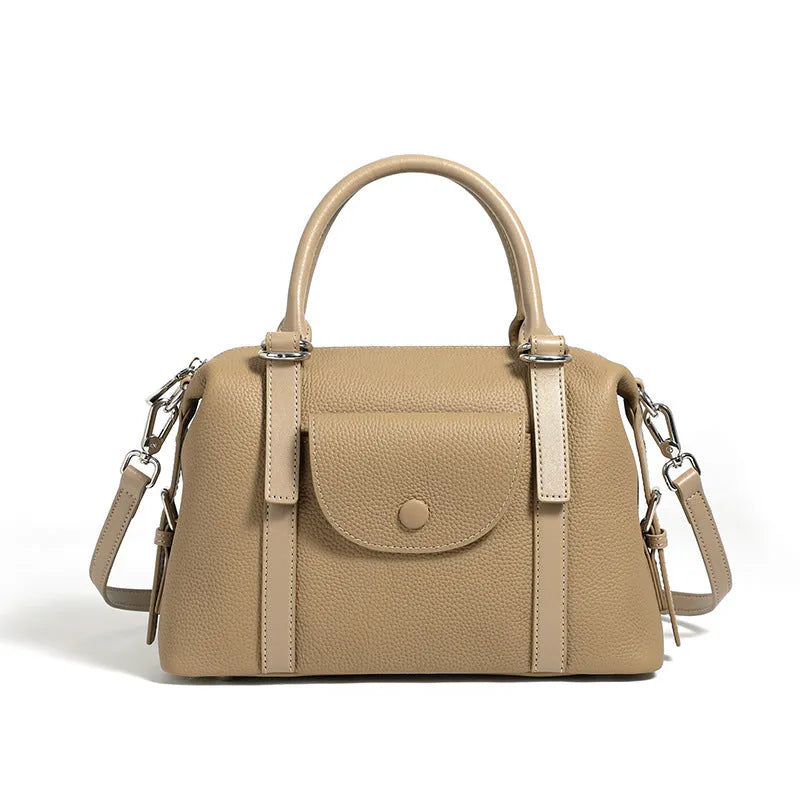 Genuine leather street style handbag for women with adjustable shoulder strap.