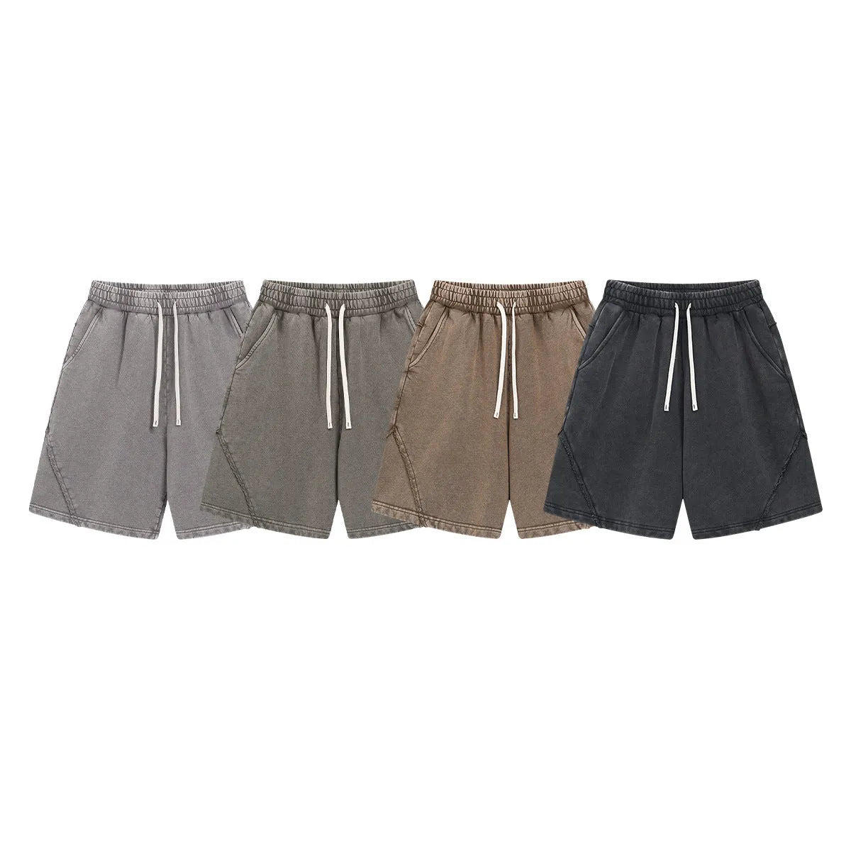Man wearing loose-fit batik washed cotton terry shorts in a retro style with patch craft details.