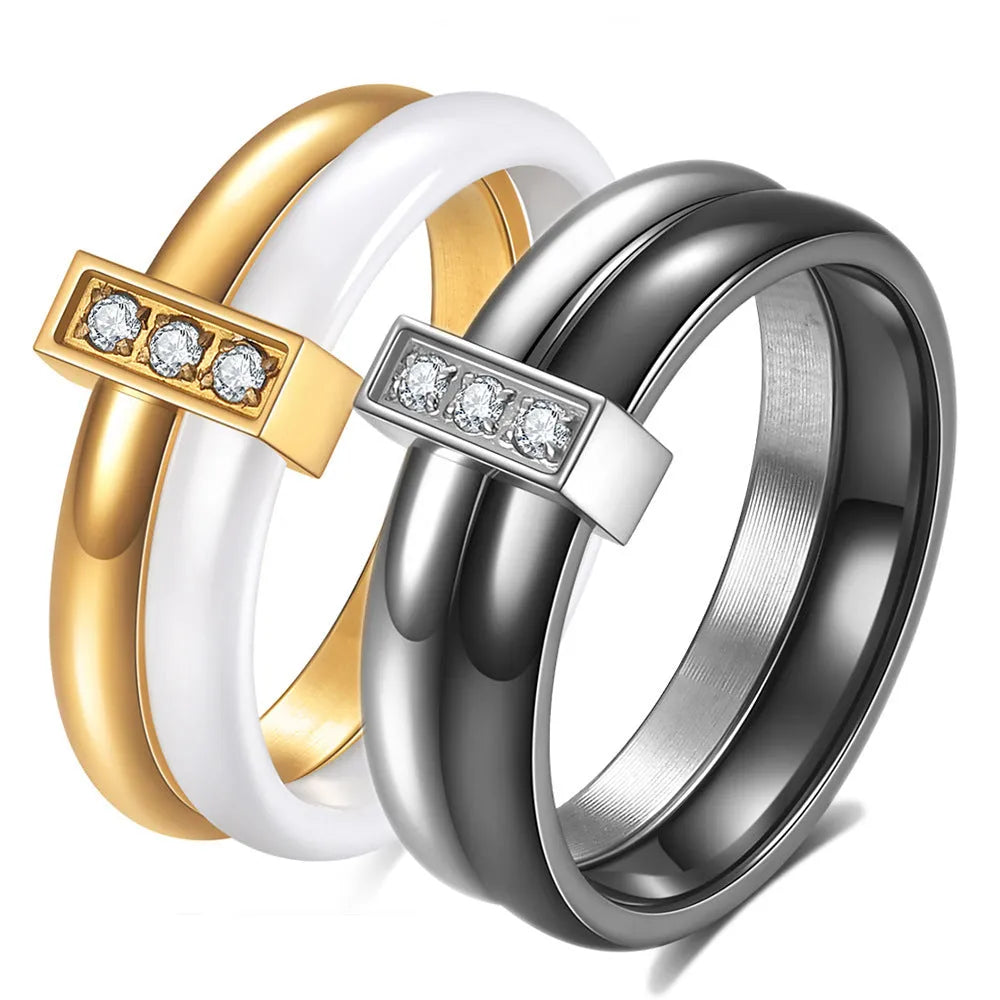 Ceramic geometric women's ring with glossy stitching and zirconium elements in steel black colour