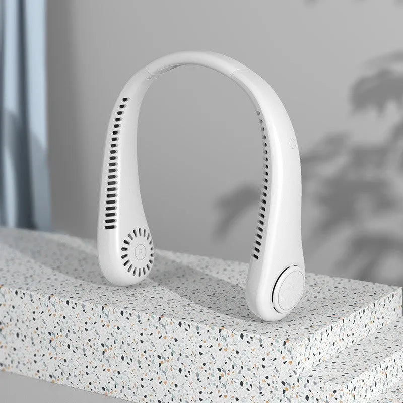 Pink portable bladeless neck fan being worn, showing flexible neckband and air outlets.