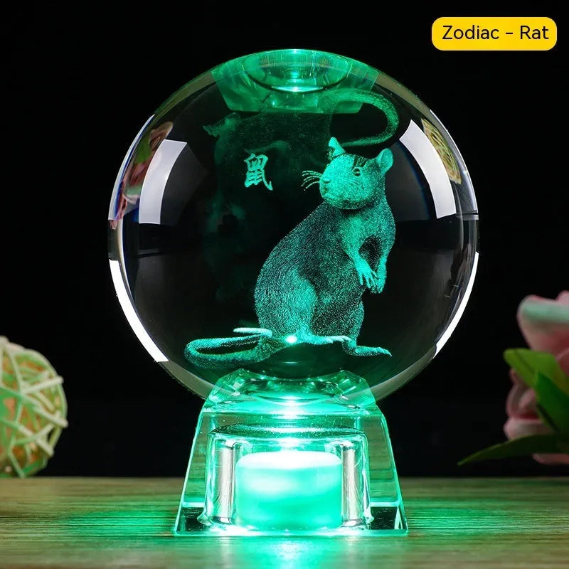 White crystal ball zodiac ornament with electronic base showing Chinese animal design