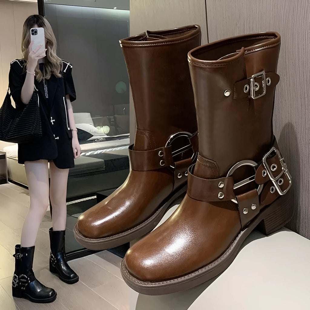 Women's black platform boots with buckle detailing and mid-calf length