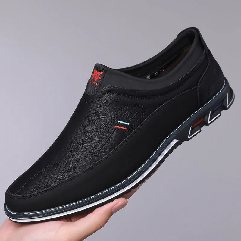 Men's casual leather shoes in black with rubber sole, low top, and leather toe cap.