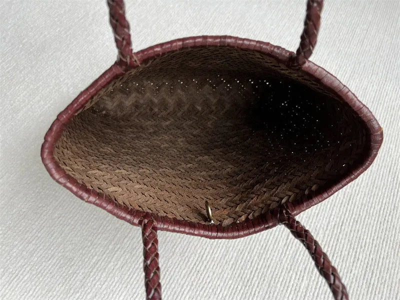 Brown woven leather tote bag with three-dimensional outer pocket and genuine cowhide construction