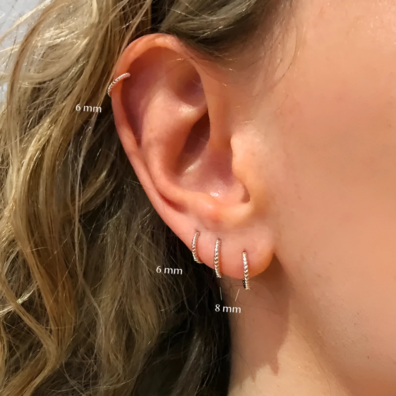 S925 sterling silver twisted string round ring earrings in gold or white gold finish.