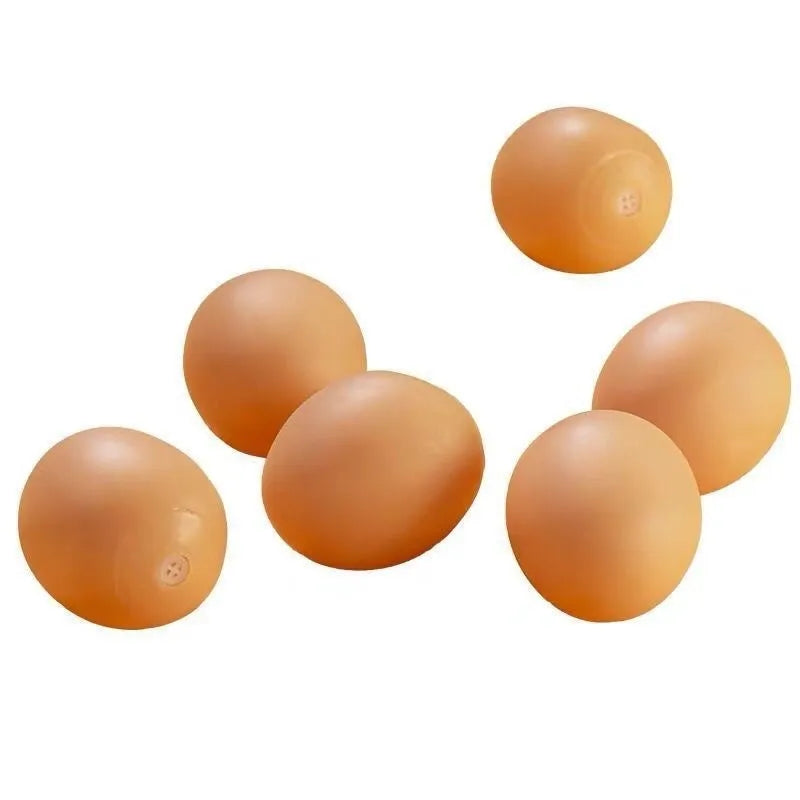 White simulation egg shaped dog toy with textured surface for teeth cleaning