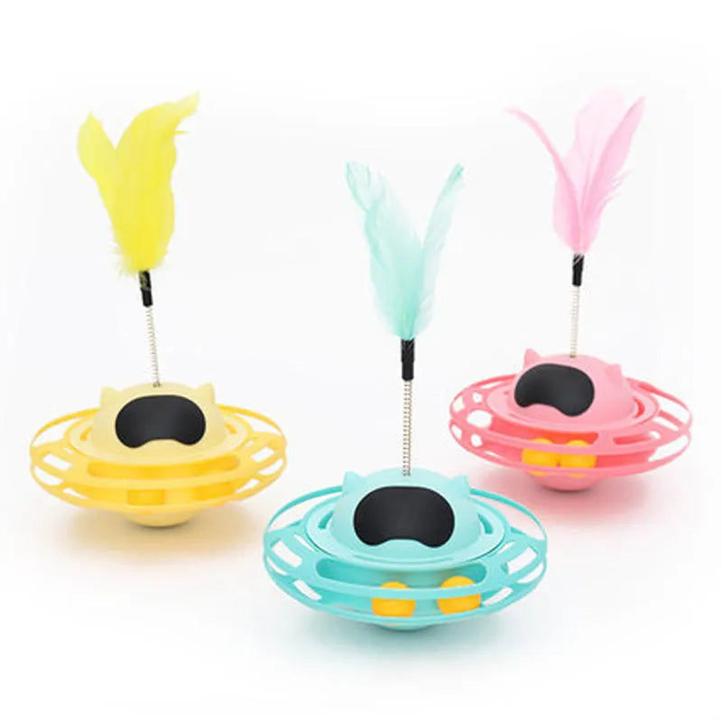 Pink cat stick toy with a tumbler turntable design on a white surface.