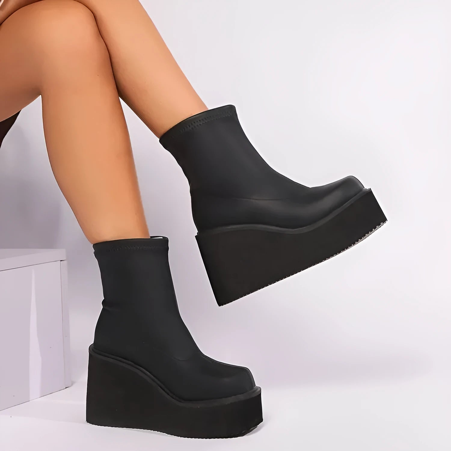 Black women's wedge ankle boots with waterproof platform in extended sizes