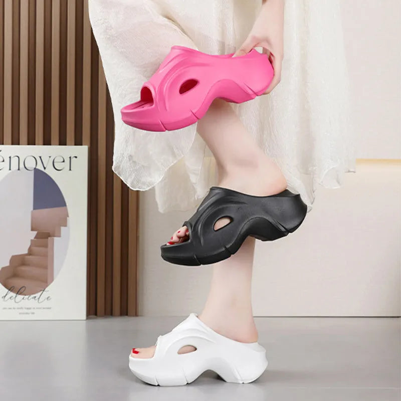 Women's thick-soled round-toe EVA slippers in rose red colour on a white background.