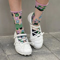 Women's silver lace-up bow sports shoes with round toe and low-top design on a white background.