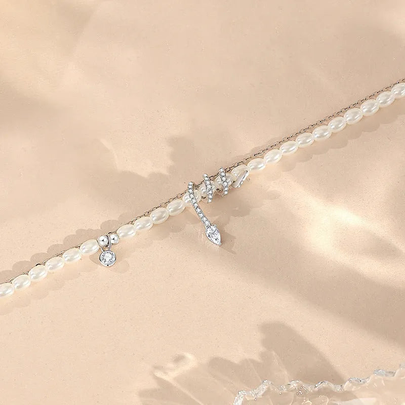 Pearl snake classic style bracelet in 925 silver with gold or white gold plating, featuring zodiac snake and geometric design