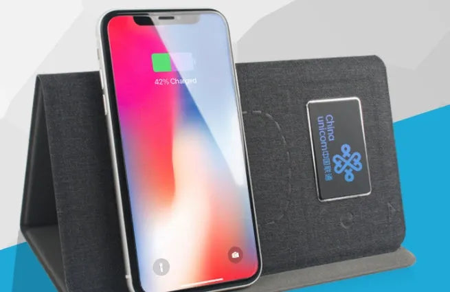 Folding wireless charging mouse pad set with luminous surface and compact Bluetooth mouse on a desk