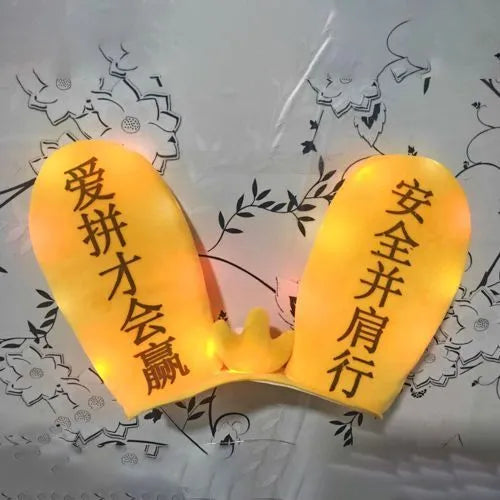 Rabbit Glow Ears helmet decoration with locomotive and ski designs on a Velcro base