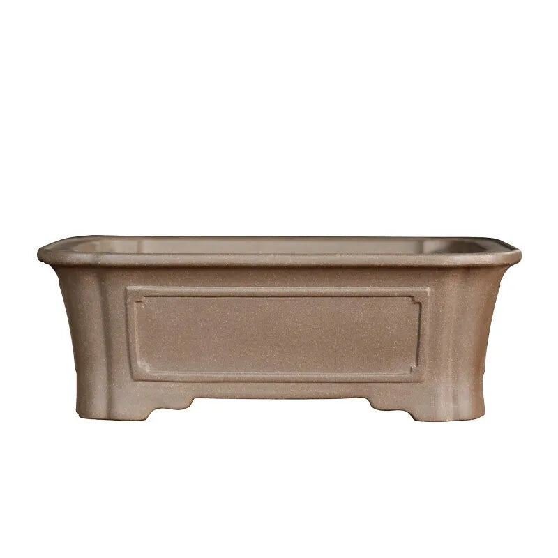 Purple sand rectangular bonsai planter with corner cutting design on wooden surface