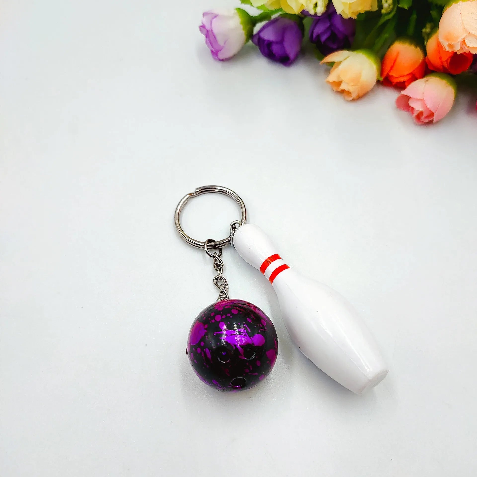 Mini bowling pin simulation keychain pendant in blue colour with metal keyring attachment