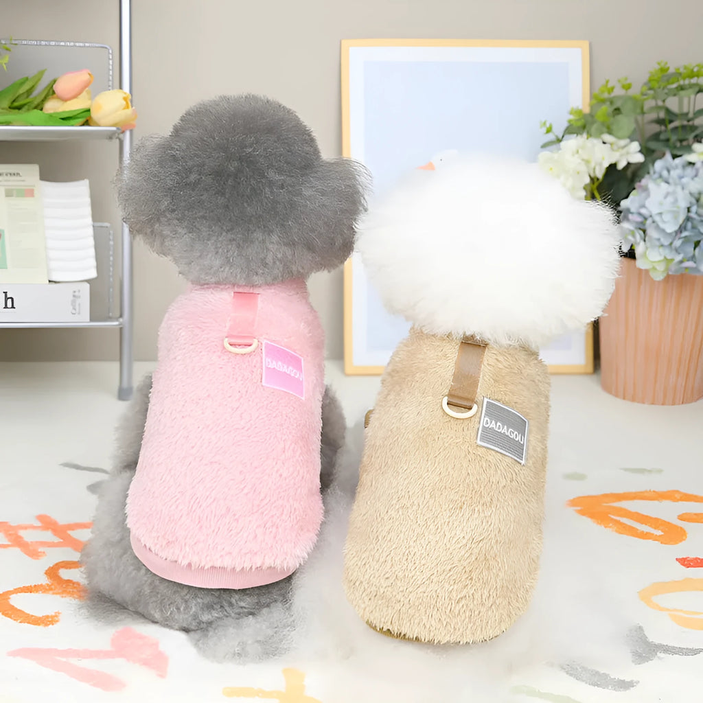 Fluffy blue coral fleece pet jacket with multi-coloured pull ring fastening on a dog model.