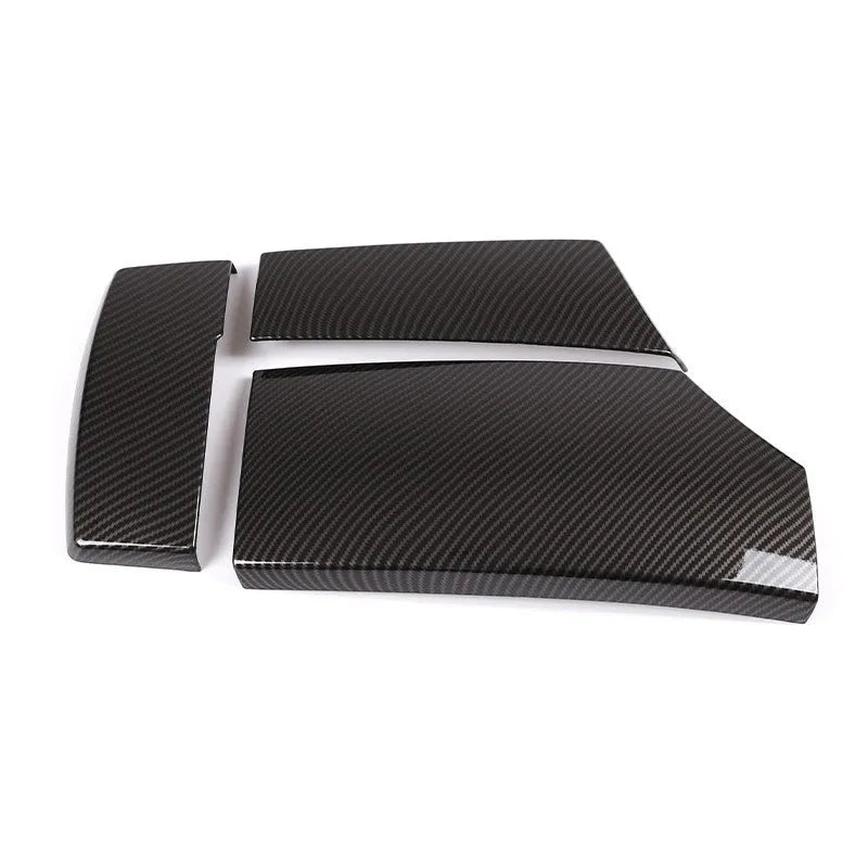Set of three black ABS plastic armrest box covers with a shiny carbon fibre pattern.