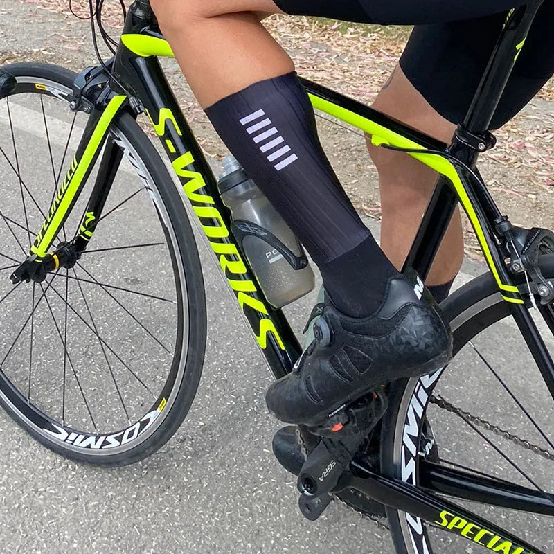 Cycling and running socks in orange colour with moisture-wicking athletic design