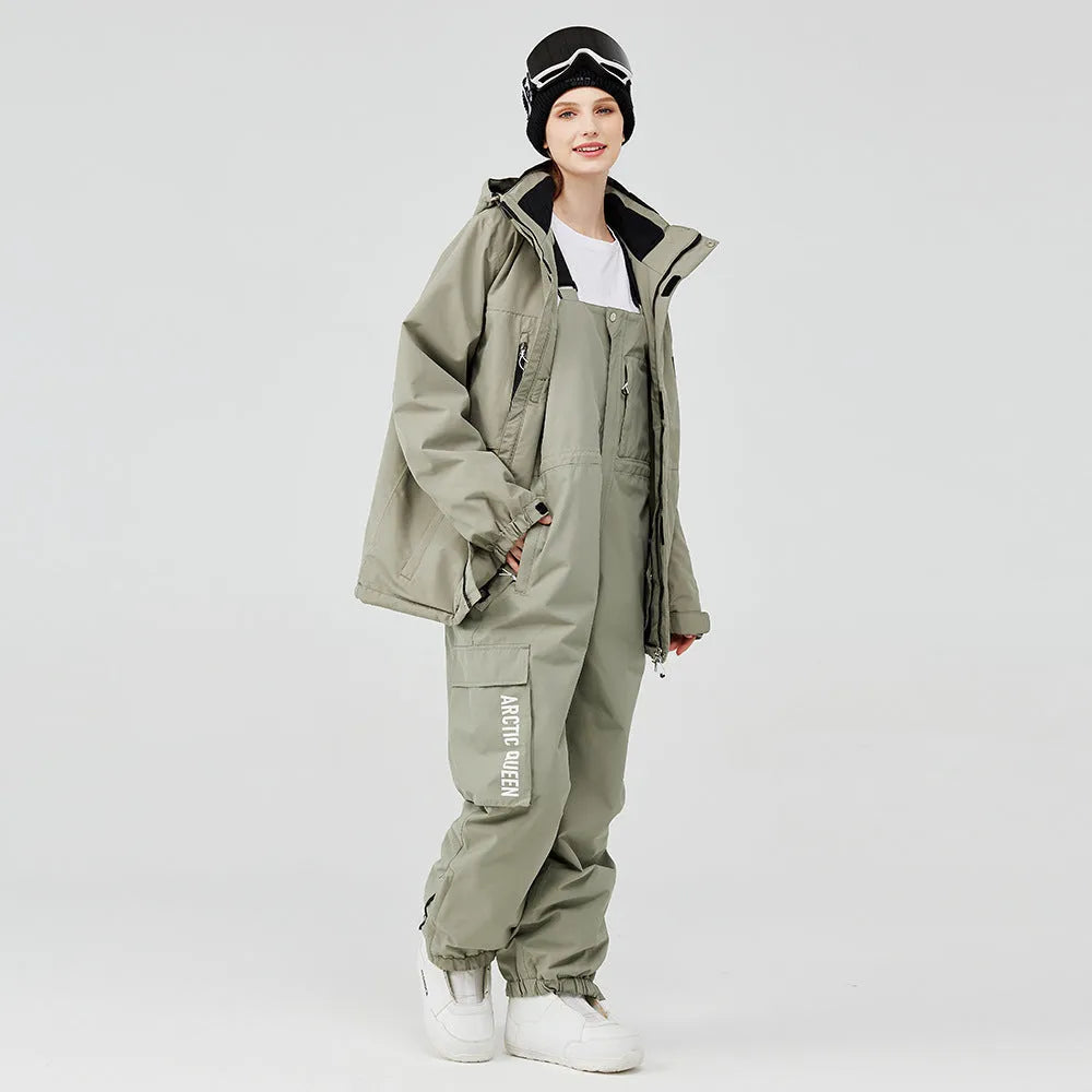 Blue and black unisex winter ski suit jacket and pants for snow sports.