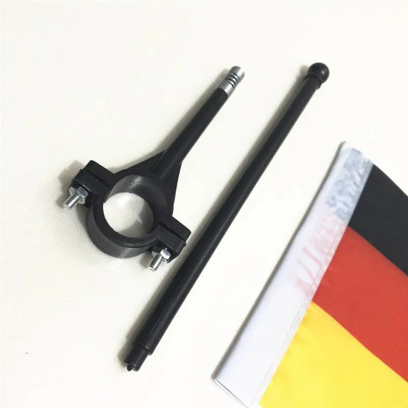 Square polyester cycling flag on a plastic pole mounted to bicycle handlebars.