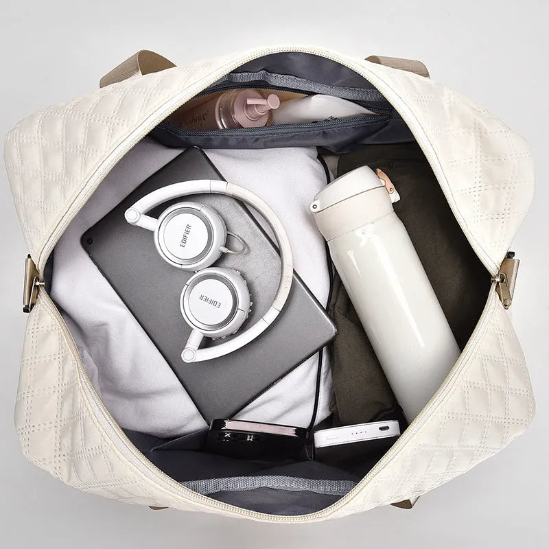 Large oxford cloth leisure travel bag in milky white colour showing storage capacity and carry handles