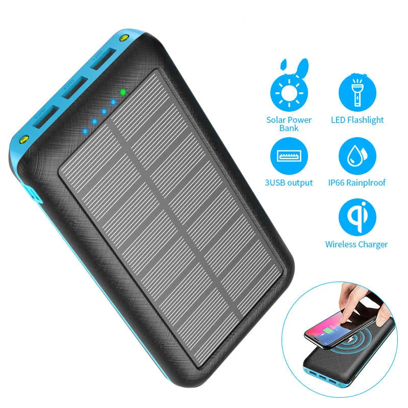 Black portable power bank with wireless Qi charging pad, three USB ports, and LED flashlight