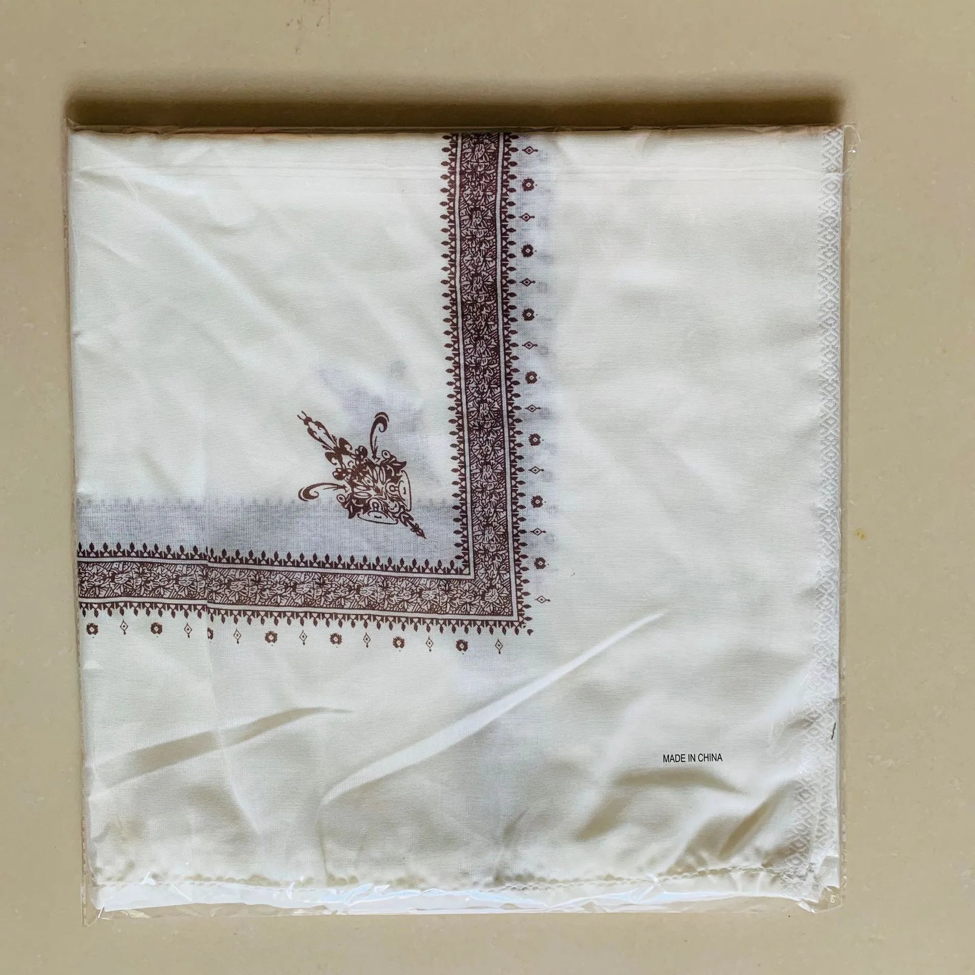 Printed square polyester scarf in a selection of colours, shown flat to display its 138x138 cm dimensions.