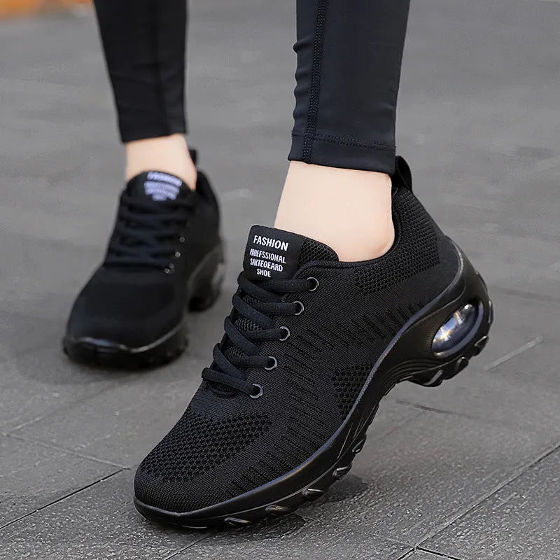 Women's black mesh sneakers with round toe and front lace-up design