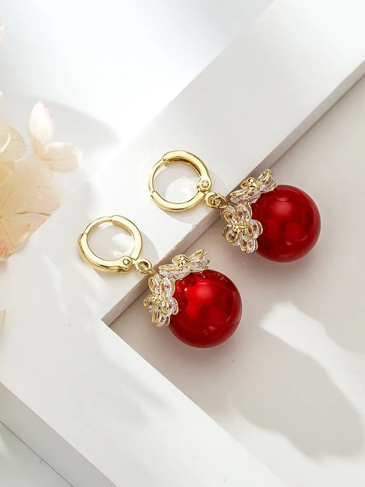 Geometric rose design copper earrings with zircon stones in an electroplated colour finish.