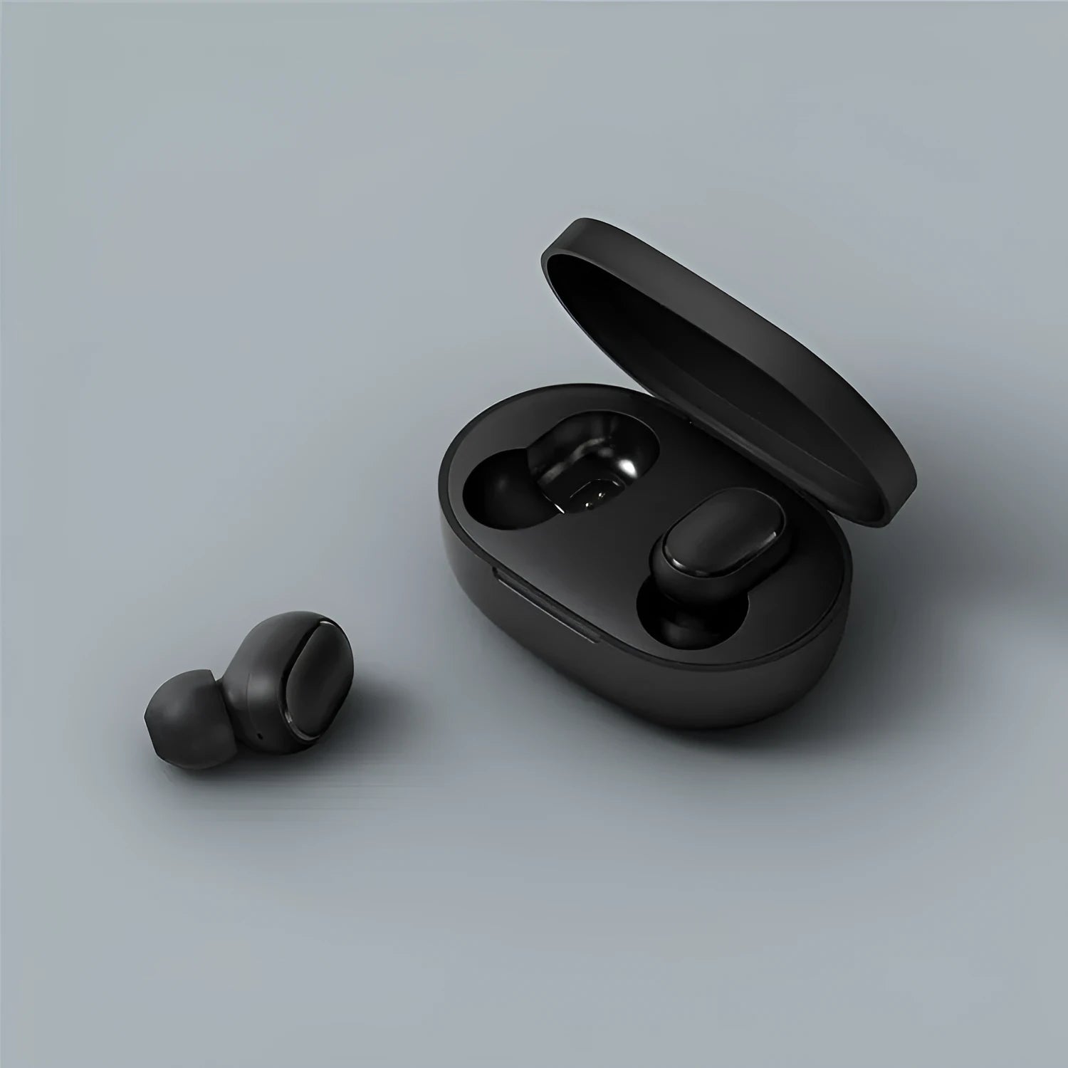Black Redmi AirDots 2 True Wireless earbuds and charging case on a white background.