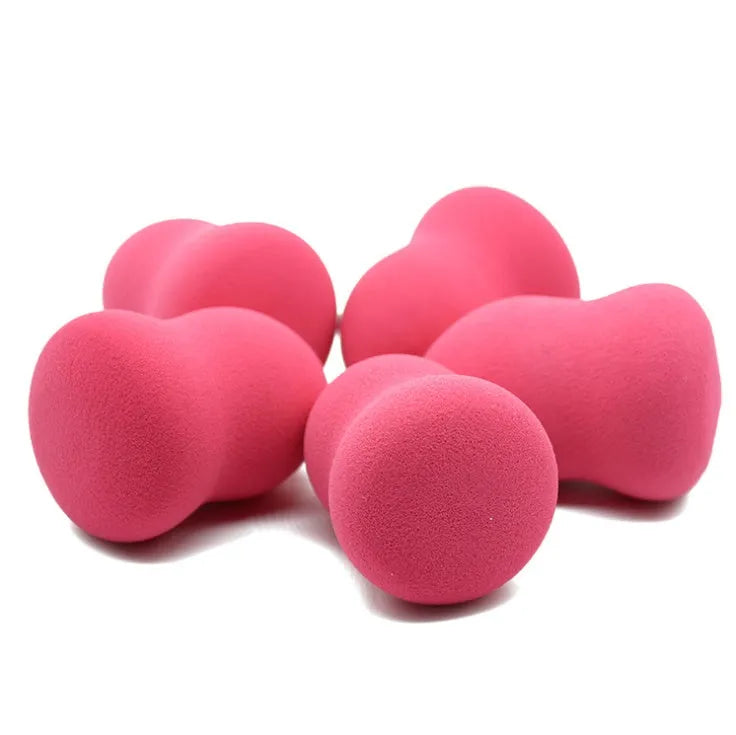 Pink hydrophilic non-latex makeup sponge measuring 4cm by 4cm by 5.6cm.