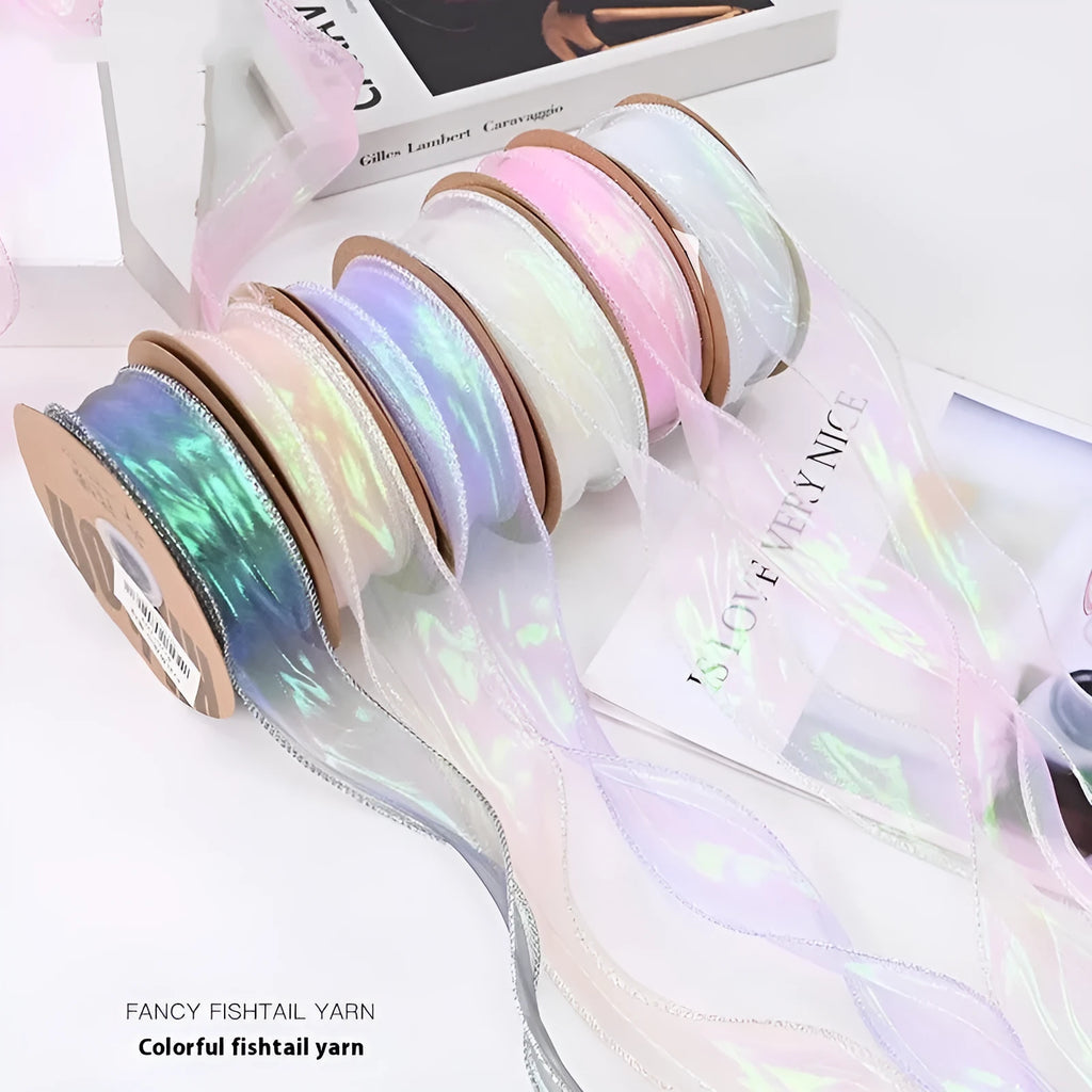 Roll of 4cm wide fishtail yarn mesh ribbon in a choice of eight illusion colours for craft and floral use.