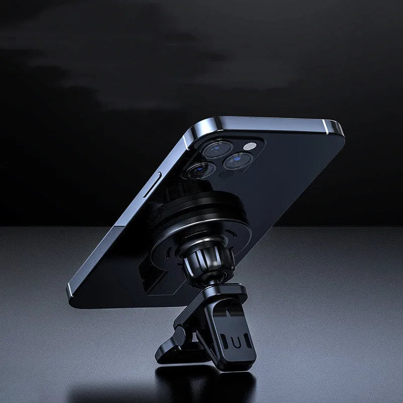 Black and white magnetic wireless charger on a desk with charging cable.