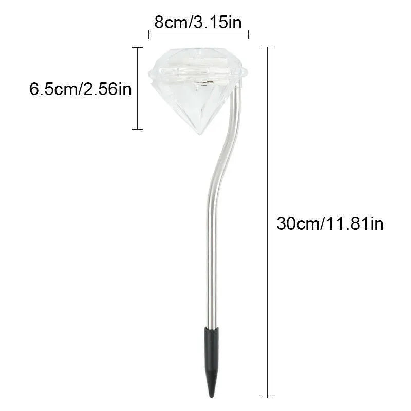 White solar-powered garden spotlight with adjustable head on a metal stake for outdoor use.