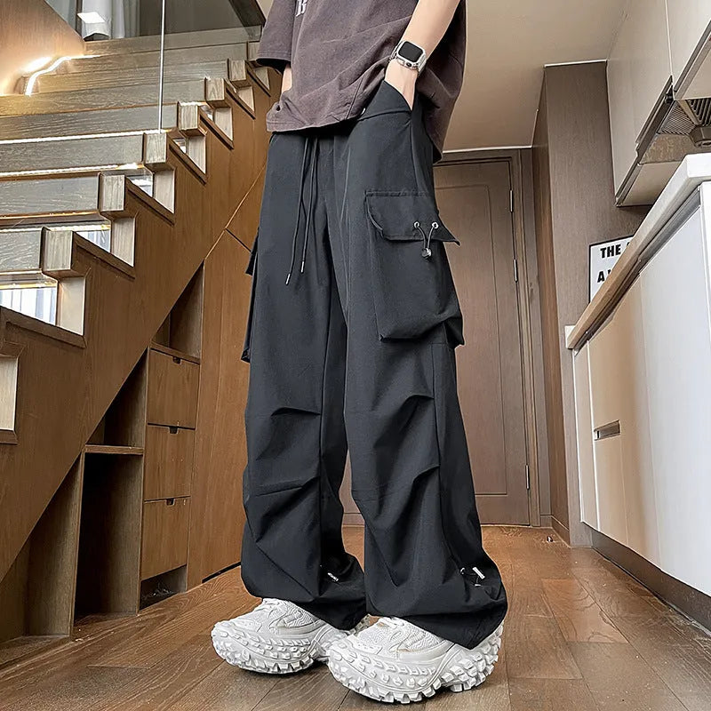 Waterproof plus size straight-leg trousers in black, white, or grey with drawstring waist