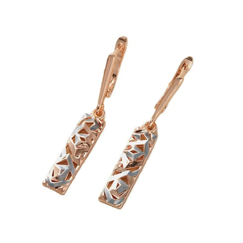 Rectangular two-tone hollow geometric alloy stud earrings for women with electroplated finish.