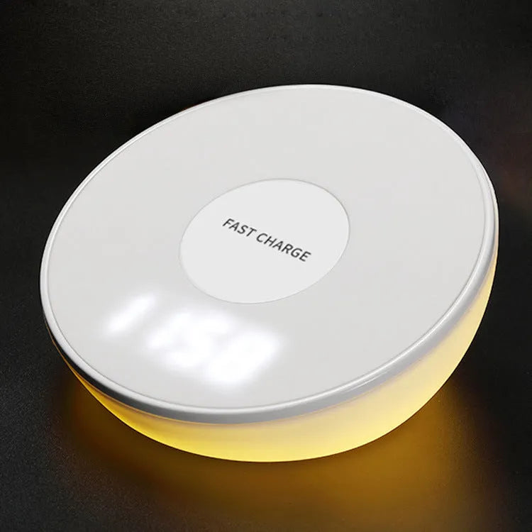 White wireless charging pad with digital clock display and three control buttons