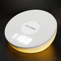 White wireless charging pad with digital clock display and three control buttons