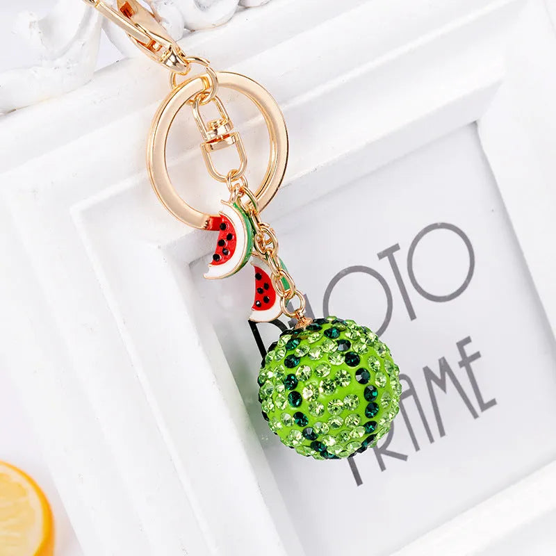 Green watermelon shaped zinc alloy keychain measuring 12cm with diamond detailing