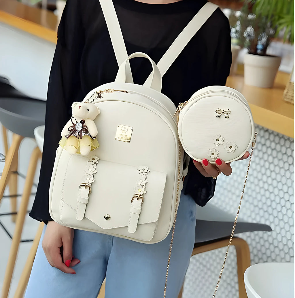 Floral design women's three-piece bag set showing backpack, shoulder bag, and card holder in PU leather.