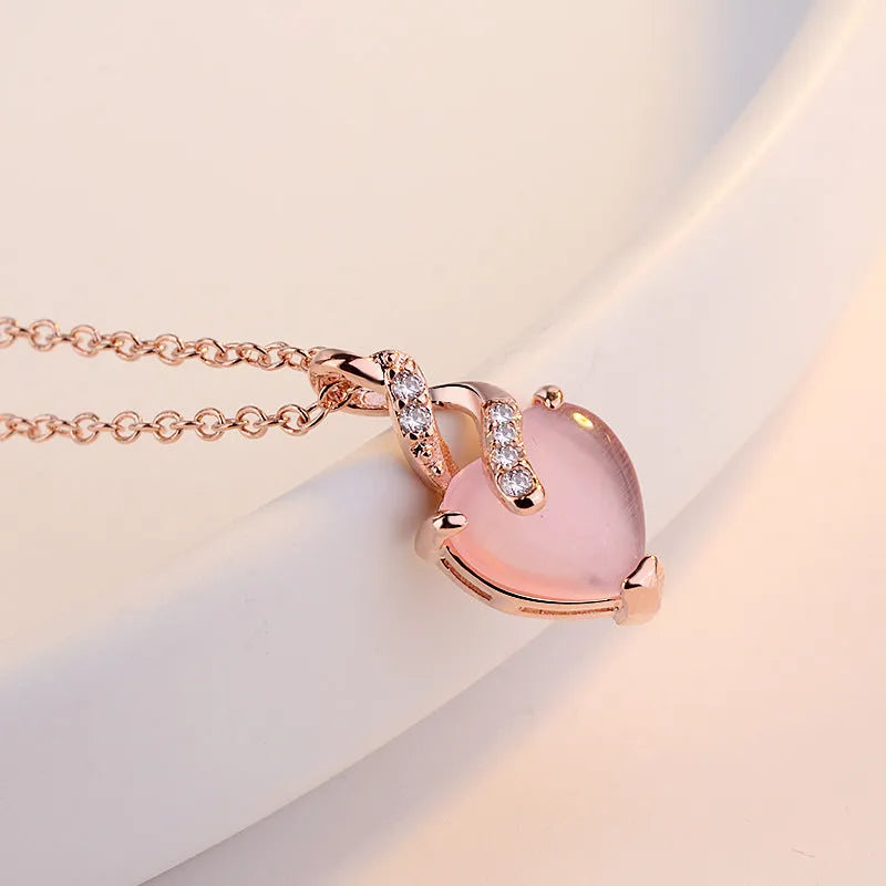 Women's heart-shaped pink crystal pendant necklace with rose gold electroplated cross chain