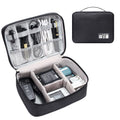 Black waterproof electronic cable organiser bag open to show mesh pockets, elastic loops, and removable padded dividers.