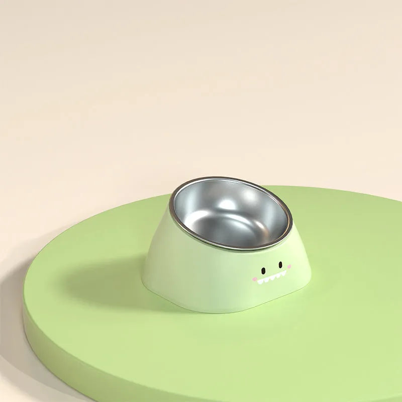 Green tilted pet bowl with stainless steel insert for cervical spine support during feeding